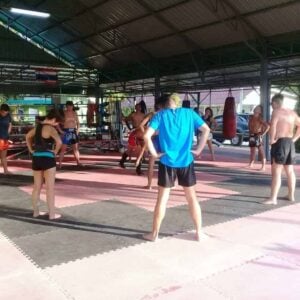 Stretching before shadow work at Honour Muay Thai, Krabi