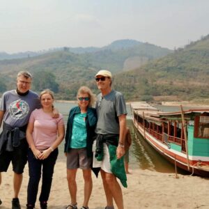 Posing by the boat on the Mekong Slow Boat Cruise